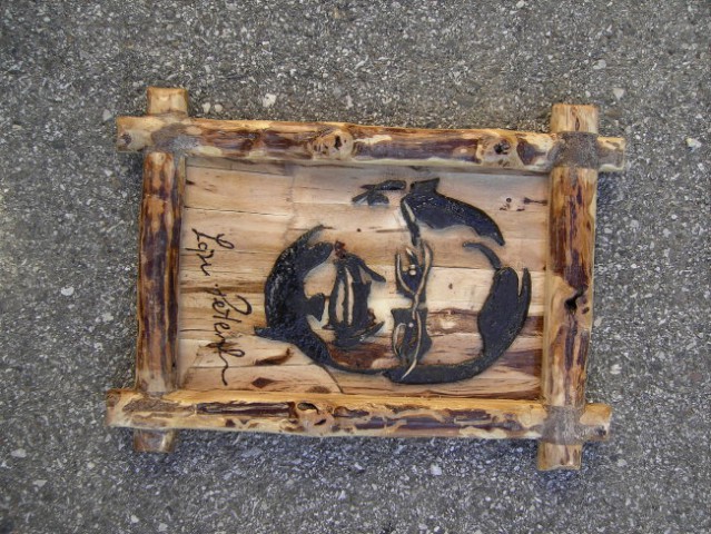 Slika Lojzeta Peterleta iz predvolilne kampanje 2007, tokrat iz lesa vinske trte
