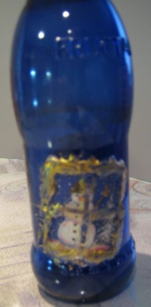 Steklenička od soka: razglednica razrezana prilepljena na steklenico,vmesni prostor zapoln